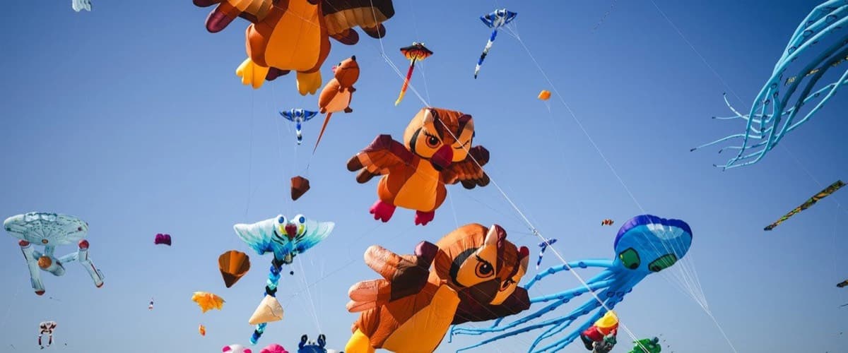 Giant inflatable kites flying over Tempelhofer Feld at the Giant Kite Festival in Berlin